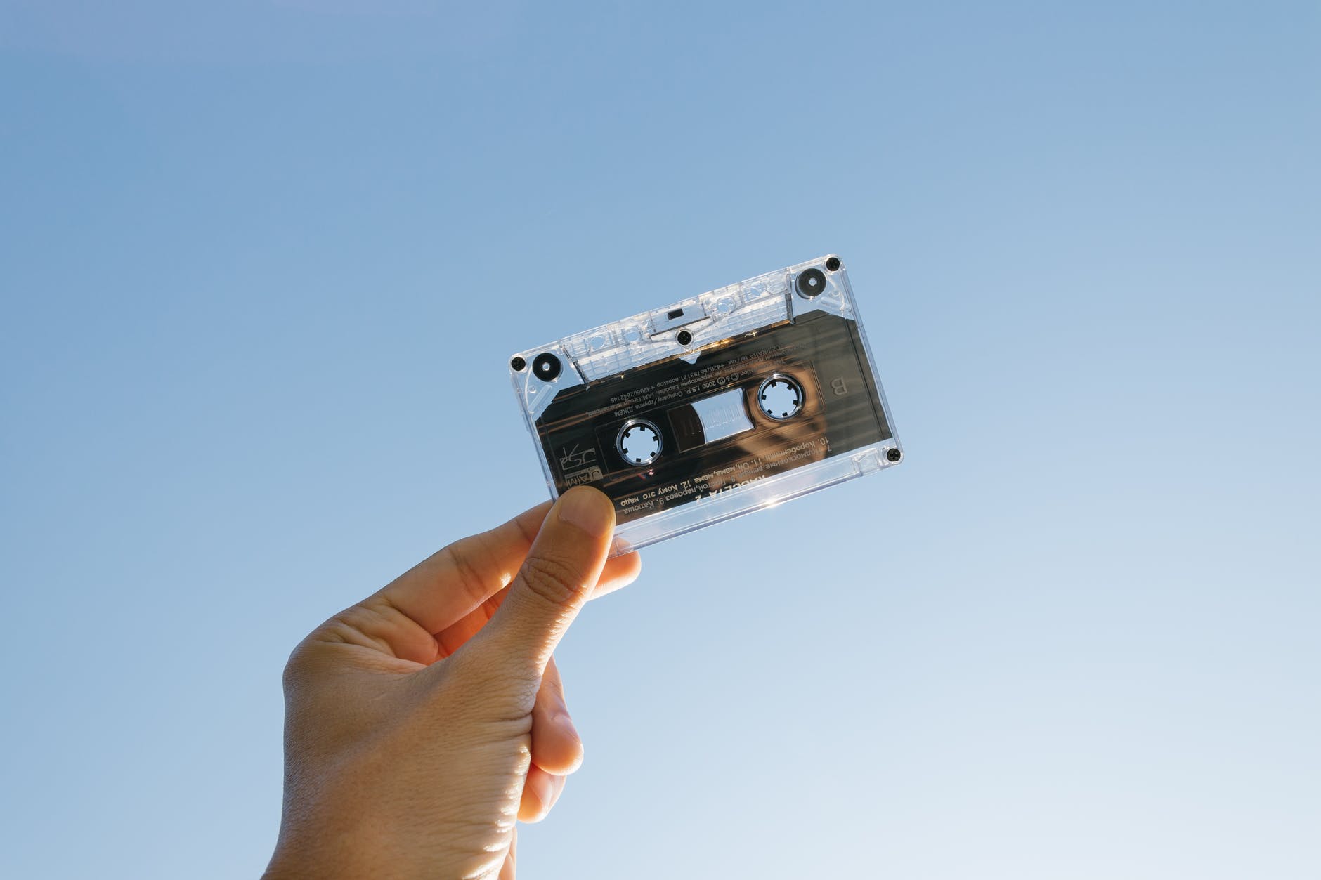 person holding cassette